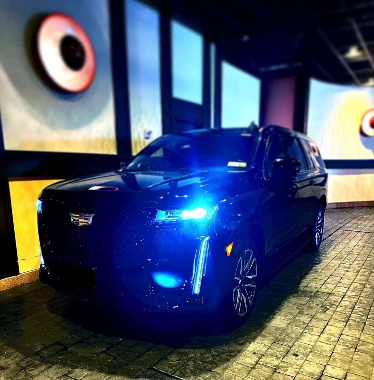 Black Cadillac SUV in Covert Cadillac of Austin showroom